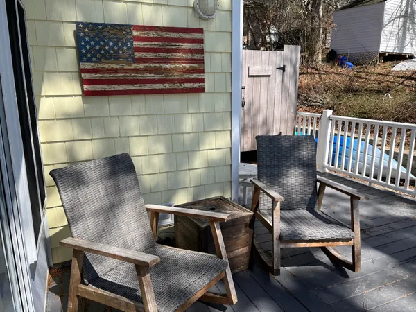 a view of a dining room with furniture and windows