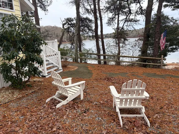 a kitchen with granite countertop a stove and a sink