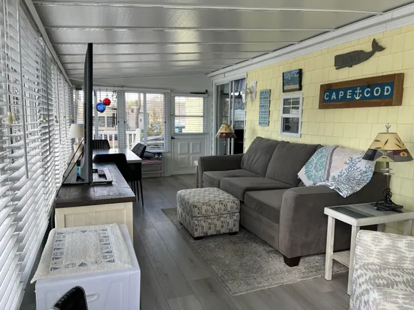 a view of a chair and table in the patio