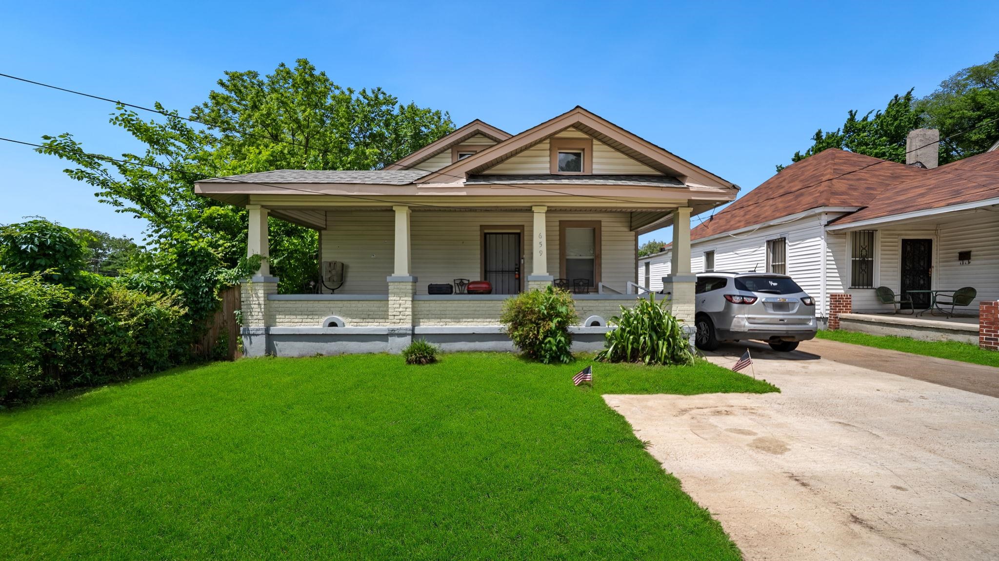 659 Decatur Street Memphis, TN 38107 - Photo 1 of 24 Craftsman-style home featuring a covered front porch with substantial columns, a pitched roofline, and dormer window