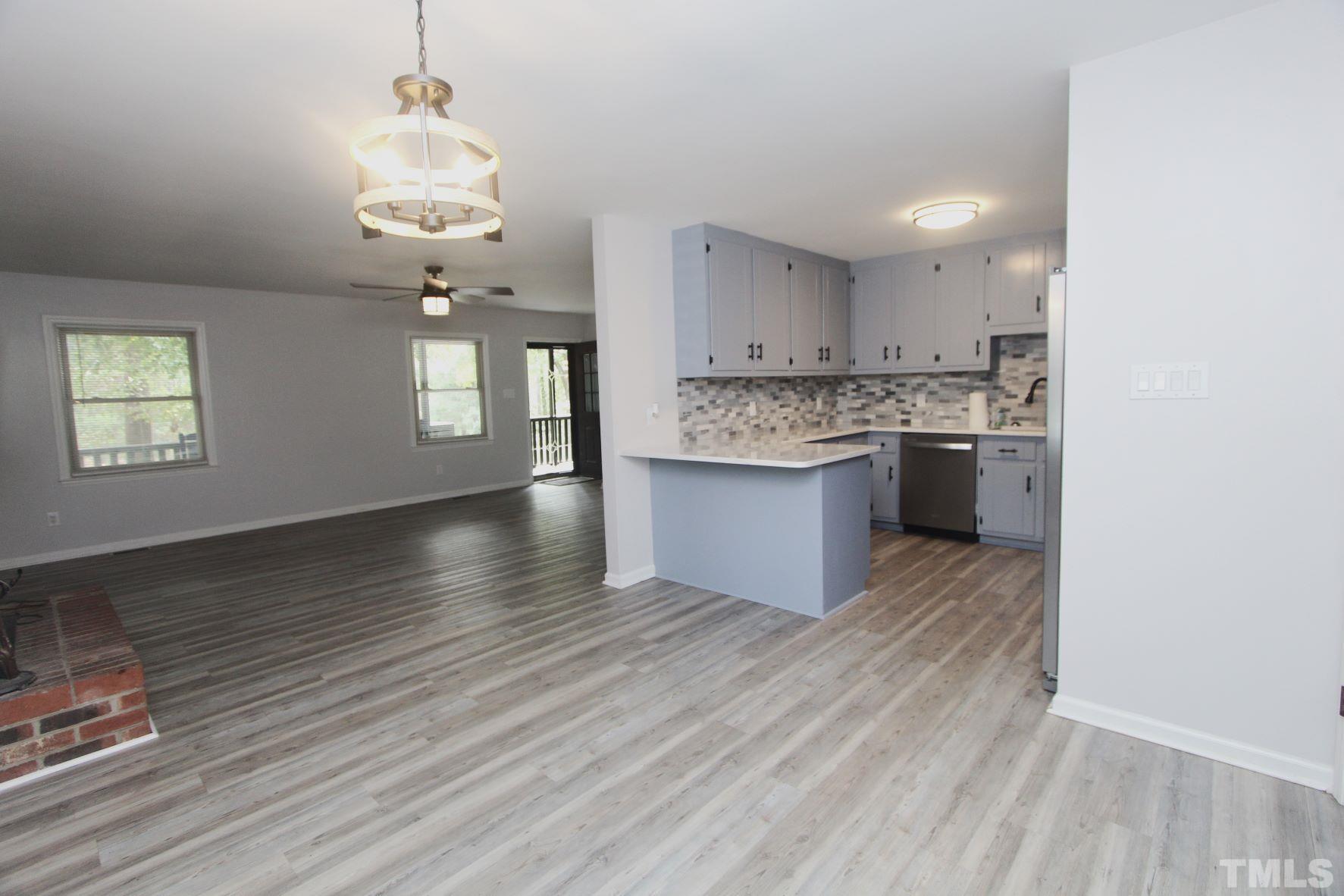 4161 Range Road Stem, NC 27581 - Photo 13 of 43 a view of kitchen and sink with wooden floor