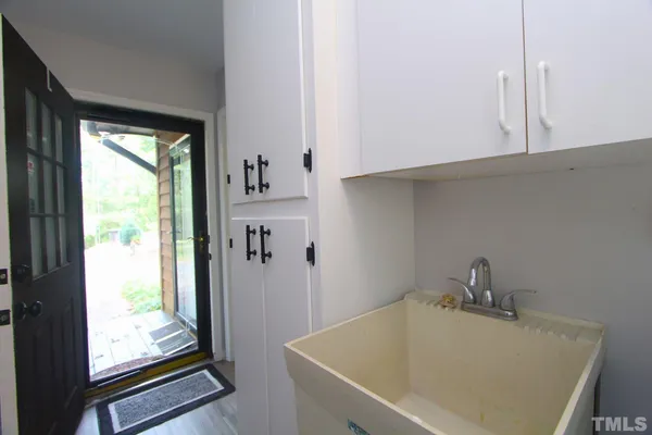a bathroom with a tub and sink