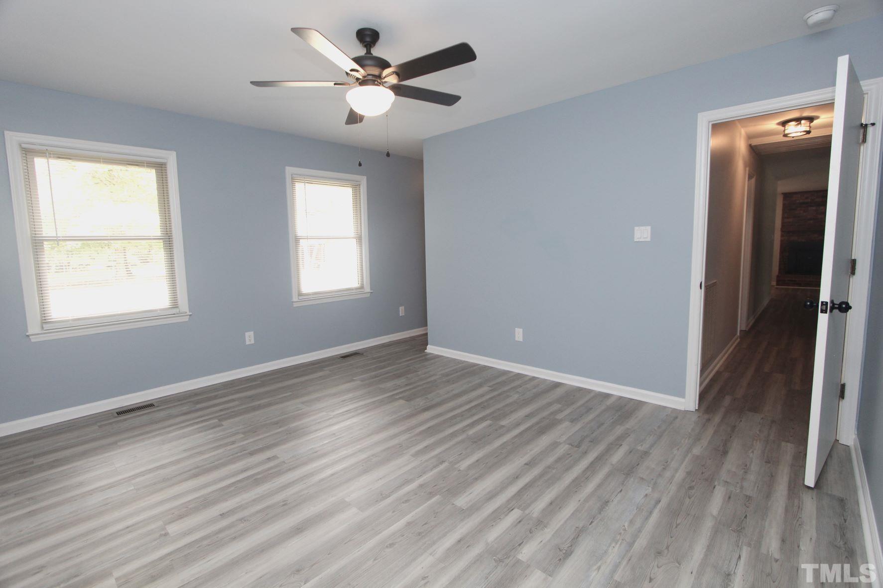 4161 Range Road Stem, NC 27581 - Photo 25 of 43 wooden floor in an empty room with a window