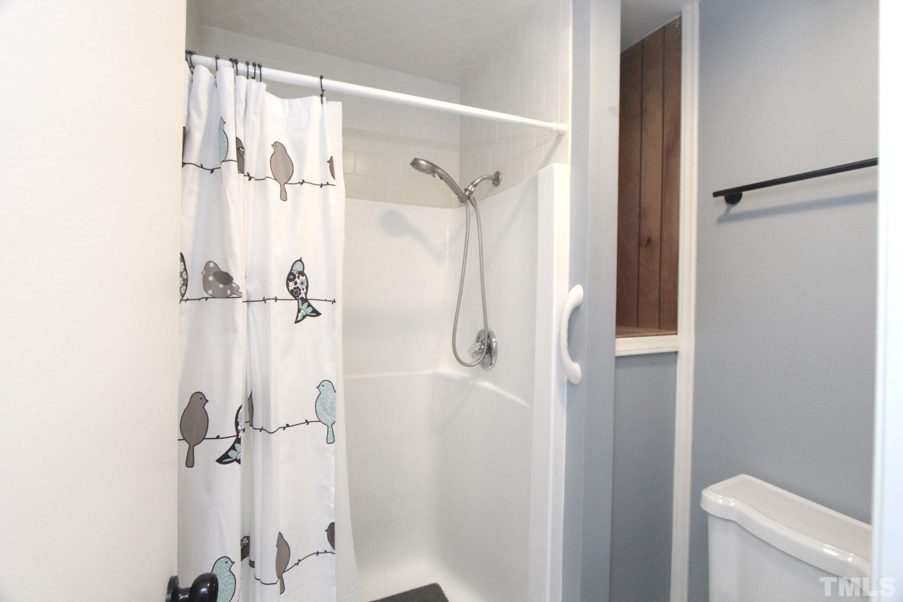 4161 Range Road Stem, NC 27581 - Photo 27 of 43 a bathroom with a shower