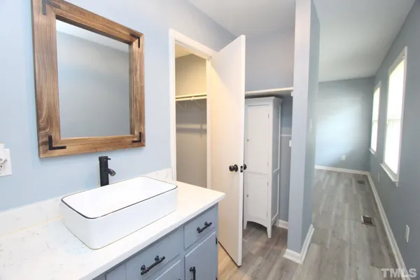 a bathroom with a sink and a mirror