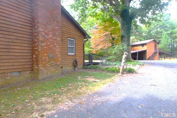 a view of a backyard with a small cabin