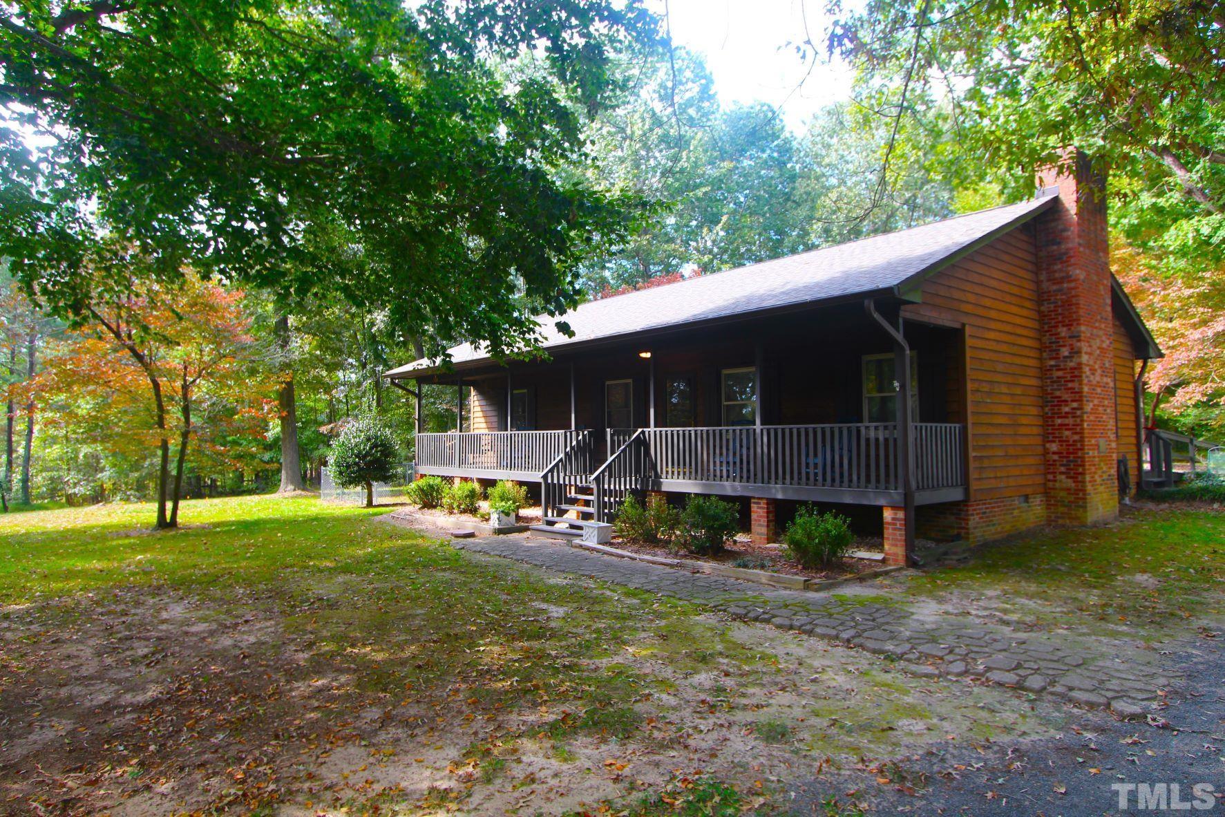 4161 Range Road Stem, NC 27581 - Photo 3 of 43 a view of a house with backyard and trees