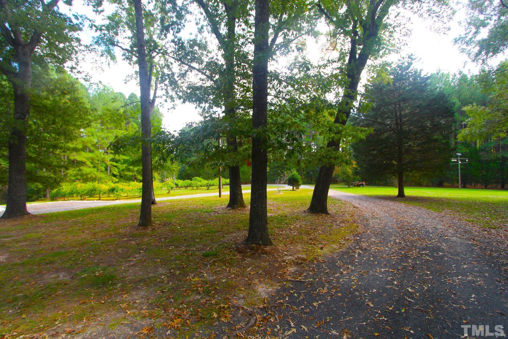 4161 Range Road Stem, NC 27581 - Photo 35 of 43 a view of a house with a yard and entertaining space