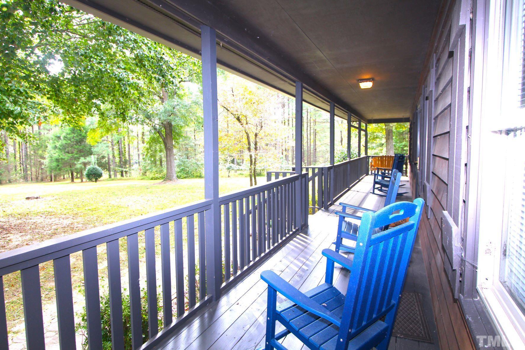 4161 Range Road Stem, NC 27581 - Photo 4 of 43 a view of balcony with wooden floor and outdoor seating