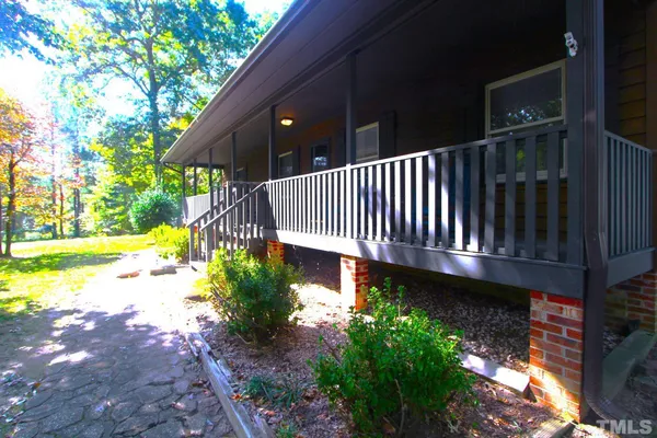 a view of a patio with a yard
