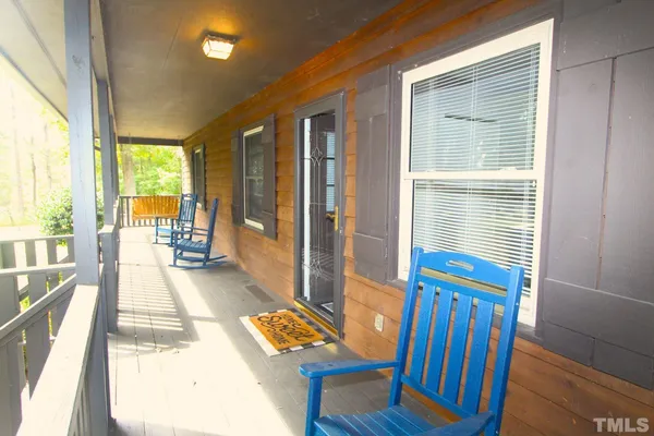 a view of an entryway with wooden floor and a yard
