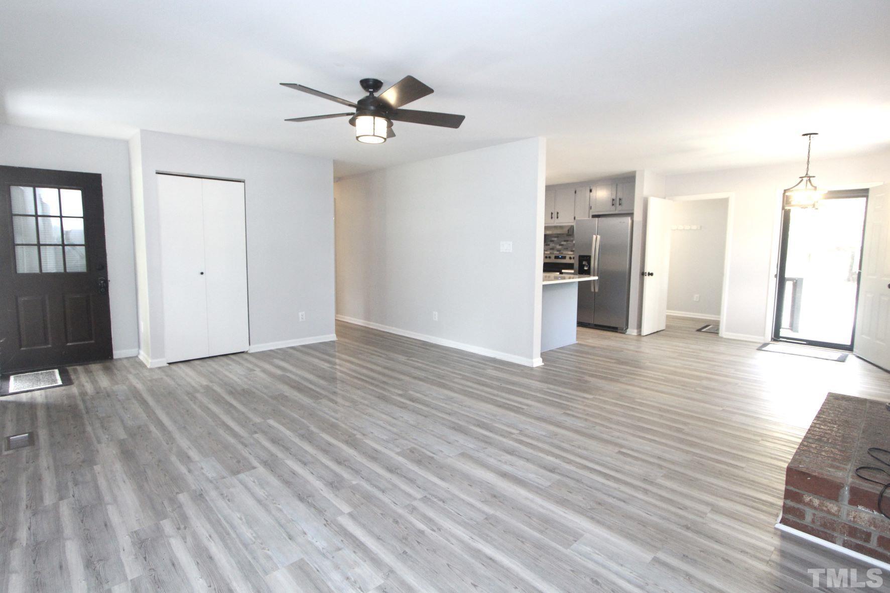 4161 Range Road Stem, NC 27581 - Photo 10 of 43 a view of a room with wooden floor and ceiling fan