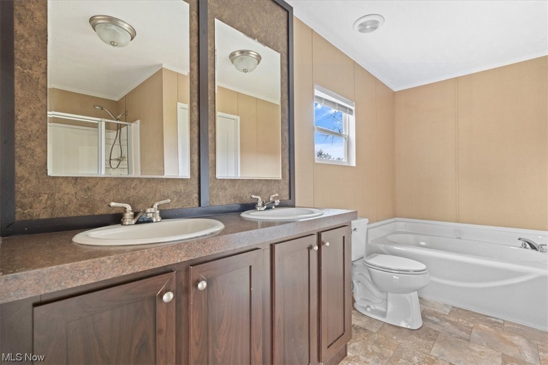 68656 Highway 124 Reedsville, OH 45772 - Photo 17 of 29 Bathroom featuring toilet, tile flooring, and dual bowl vanity