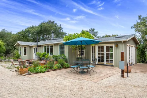 a house with outdoor seating space