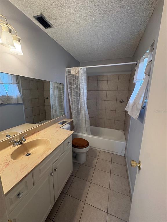 4027 Bianca Street Sebring, FL 33872 - Photo 3 of 22 a bathroom with a tub sink and toilet