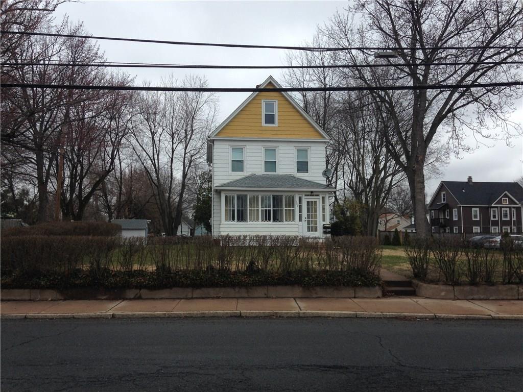 603 Center Street Manchester, CT 06040 - Photo 1 of 1 a view of a house next to a road and yard