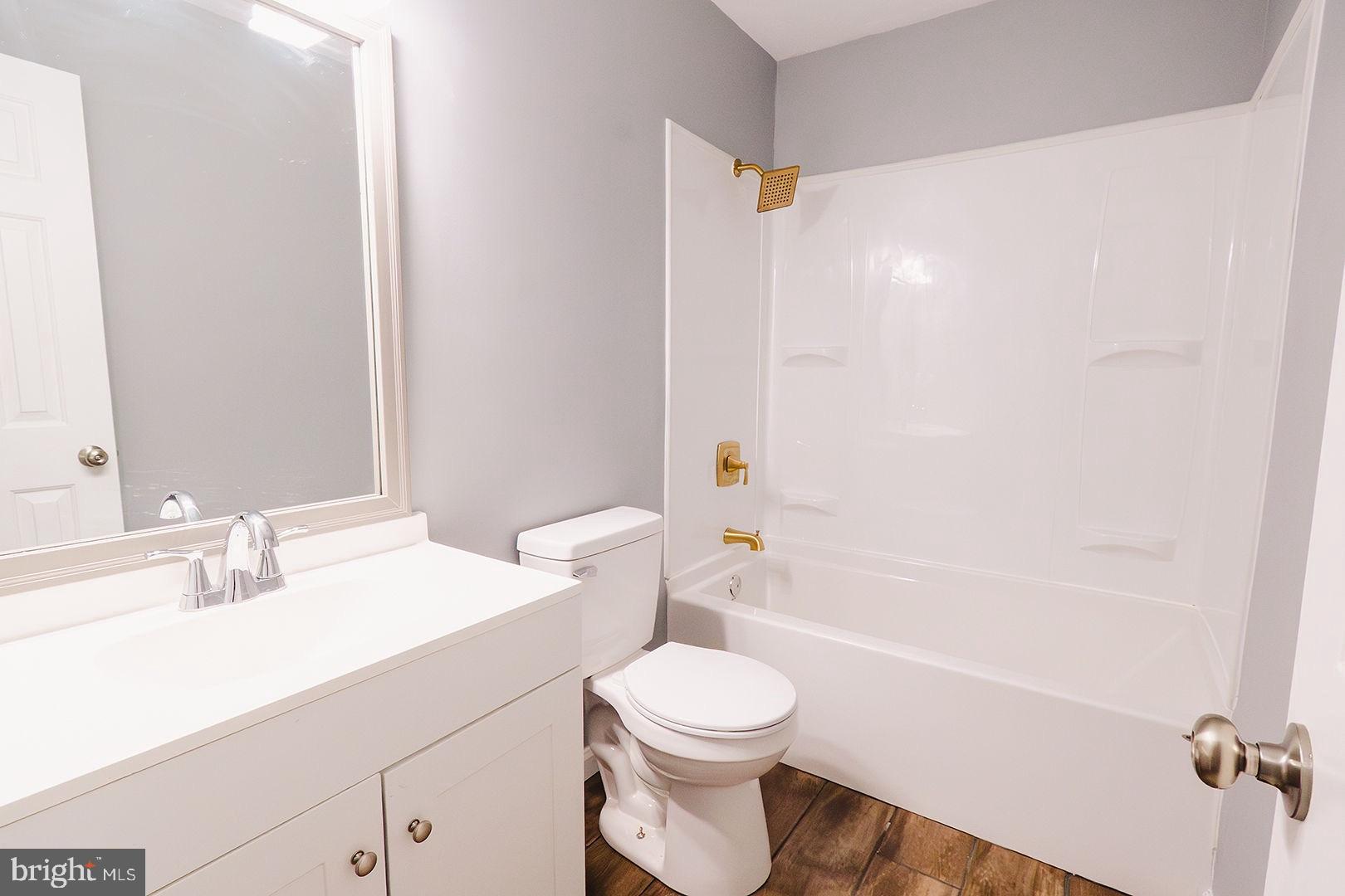 138 Parkside Road Linden, VA 22642 - Photo 23 of 38 a bathroom with a sink a toilet and shower