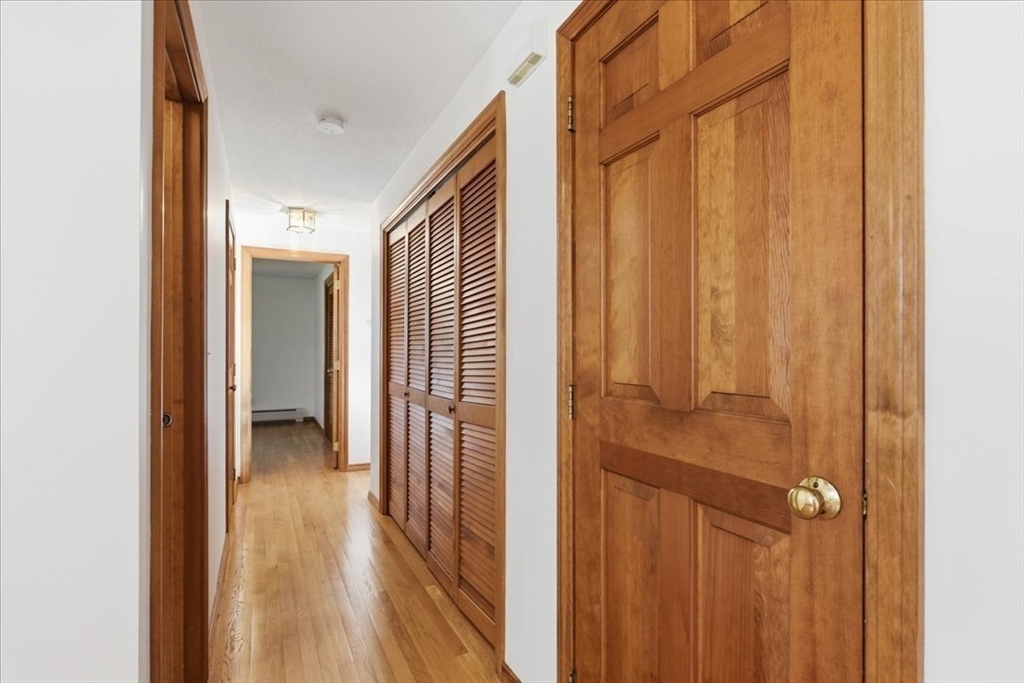 205 James Otis Road Barnstable, MA 02632 - Photo 19 of 41 a view of a hallway with wooden floor