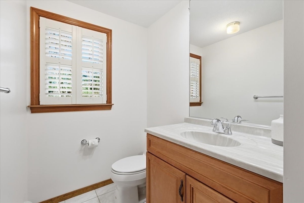 205 James Otis Road Barnstable, MA 02632 - Photo 22 of 41 a bathroom with a sink a toilet and a window