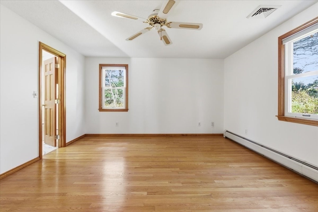 205 James Otis Road Barnstable, MA 02632 - Photo 23 of 41 wooden floor in an empty room with a window