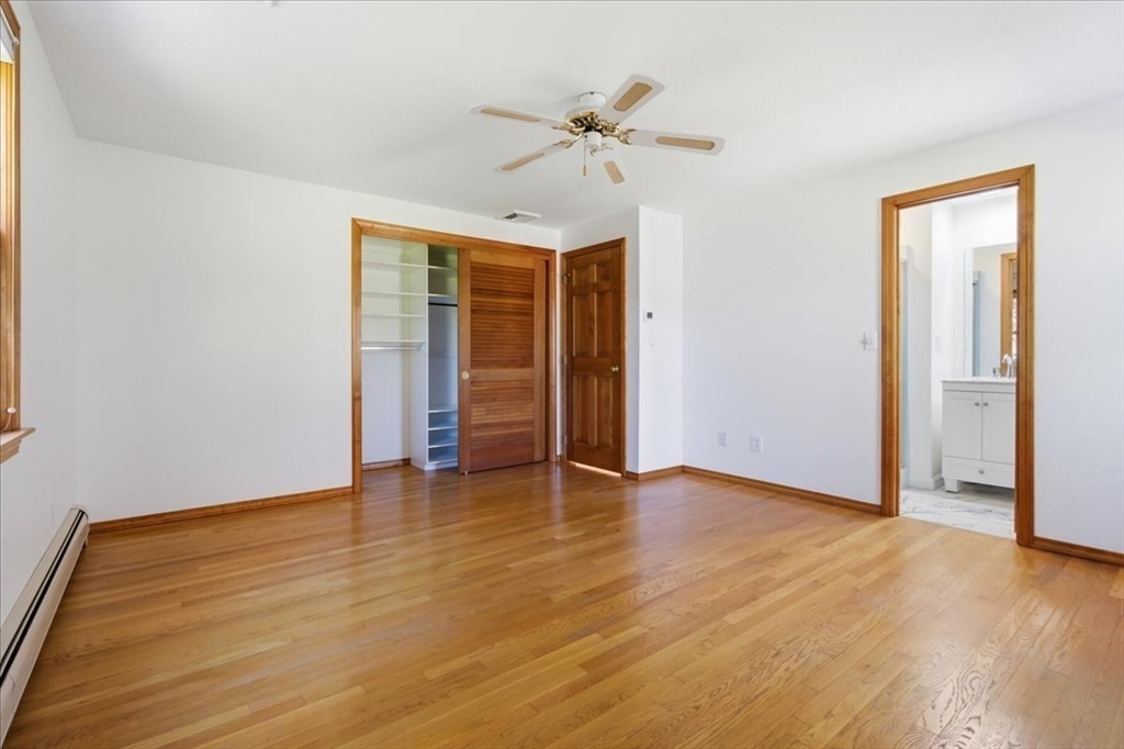 205 James Otis Road Barnstable, MA 02632 - Photo 24 of 41 an empty room with wooden floor closet and windows