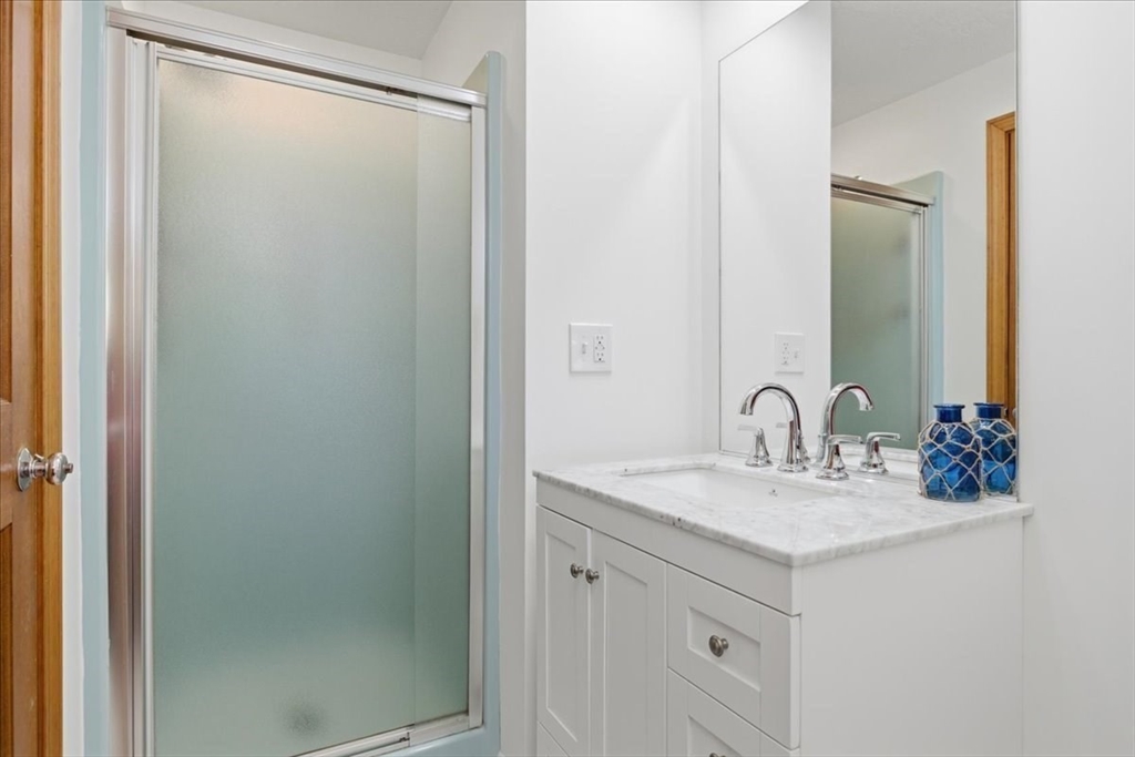 205 James Otis Road Barnstable, MA 02632 - Photo 26 of 41 a bathroom with a sink and a mirror