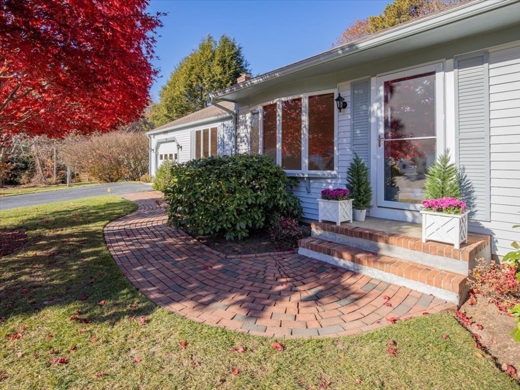 205 James Otis Road Barnstable, MA 02632 - Photo 3 of 41 a front view of a house with garden