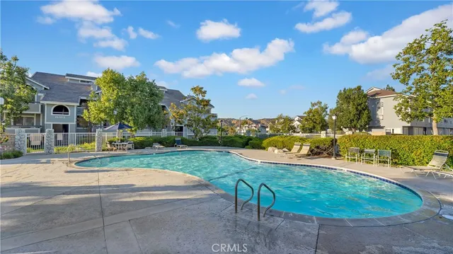 a view of a backyard with sitting area