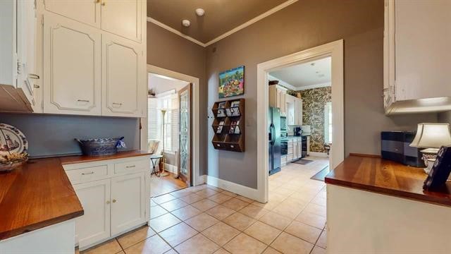 5975 Calder Avenue Beaumont, TX 77706 - Photo 11 of 35 a view of a kitchen with furniture and a window