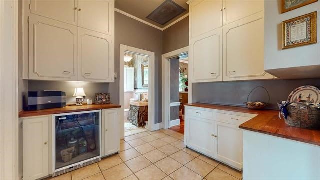 5975 Calder Avenue Beaumont, TX 77706 - Photo 12 of 35 a kitchen with stainless steel appliances granite countertop a stove and a refrigerator