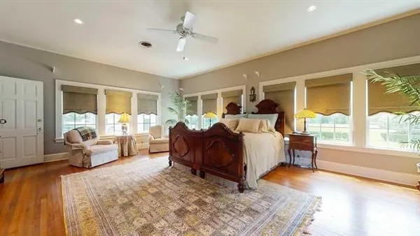 a bed room with furniture and a large window