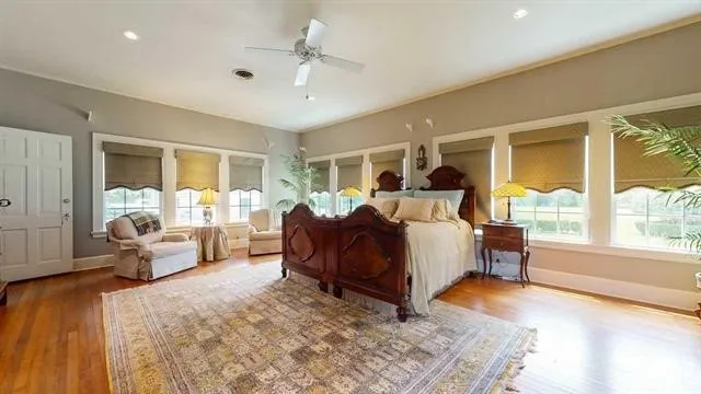 a bed room with furniture and a large window