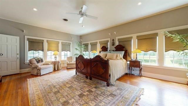 5975 Calder Avenue Beaumont, TX 77706 - Photo 14 of 35 a bed room with furniture and a large window