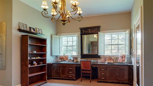 5975 Calder Avenue Beaumont, TX 77706 - Photo 16 of 35 a view of a workspace with furniture and a window
