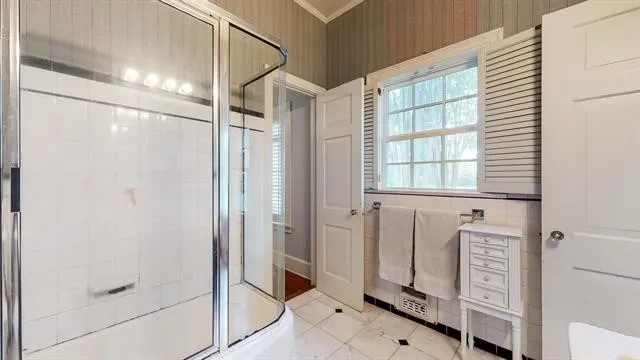 a bed room with furniture and a window