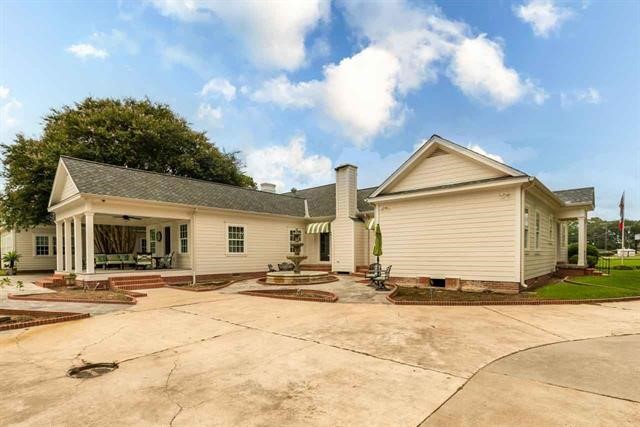 5975 Calder Avenue Beaumont, TX 77706 - Photo 30 of 35 a view of a white house with a patio