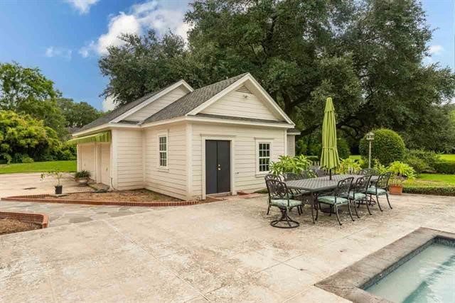 5975 Calder Avenue Beaumont, TX 77706 - Photo 31 of 35 a view of a house with patio and a backyard