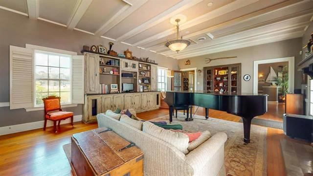 5975 Calder Avenue Beaumont, TX 77706 - Photo 5 of 35 a living room with furniture and a table