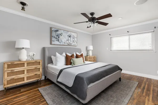 a bedroom with a bed and window