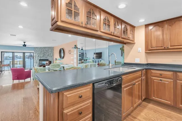 a kitchen with stainless steel appliances granite countertop a sink and cabinets