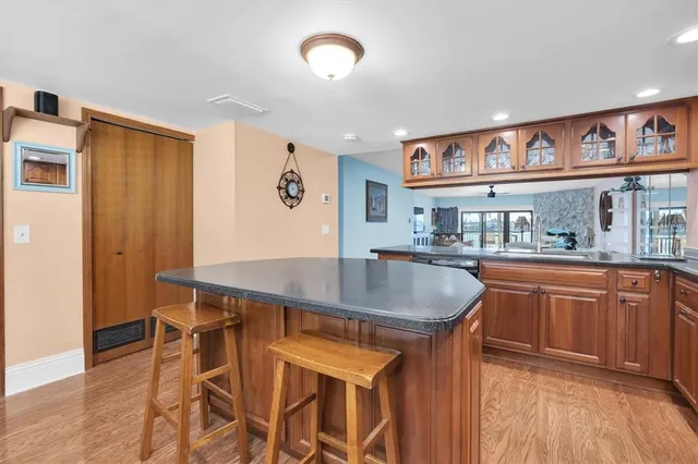a dining table with chairs and wooden floor
