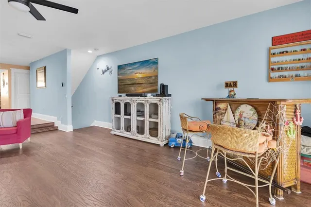 a view of a livingroom with furniture and a flat screen tv