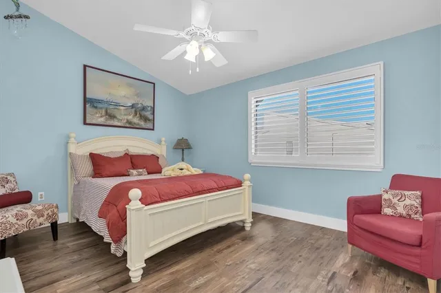 a bedroom with bed and a couch