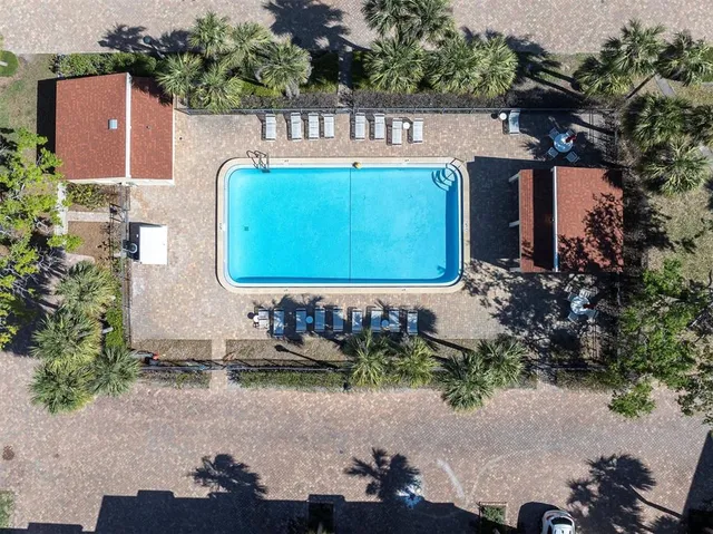 a view of a swimming pool with a house