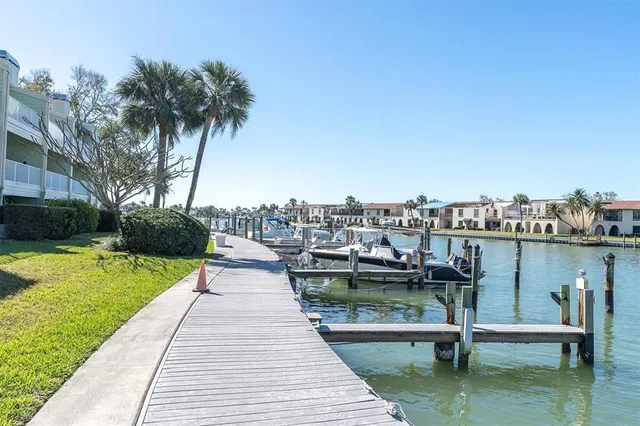 a view of a lake with wooden bridge