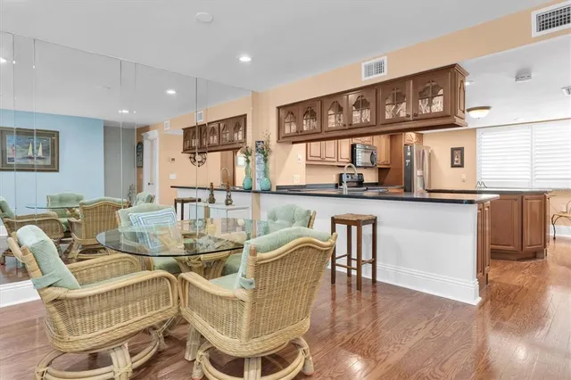 a view of a dining room with furniture and wooden floor