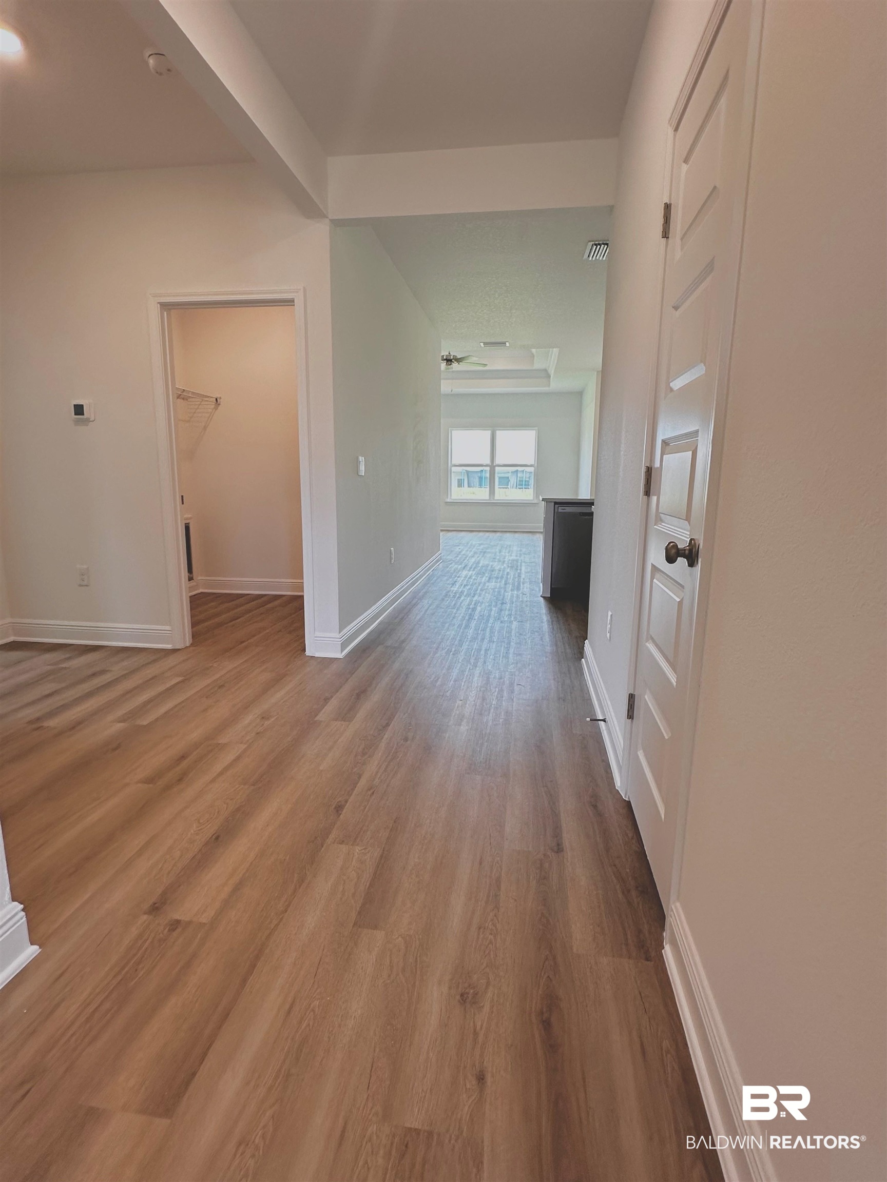 12946 Grand Rpds Road Fairhope, AL 36532 - Photo 5 of 19 Hall with hardwood / wood-style floors