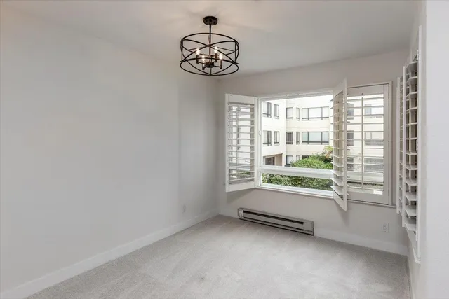 a view of room with window and ceiling fan
