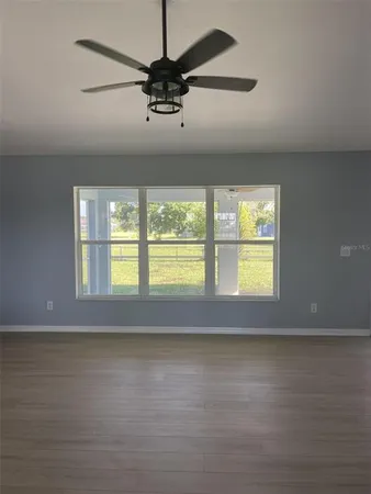a view of room window and wooden floor