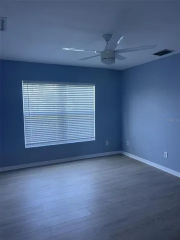 an empty room with a empty space and a window